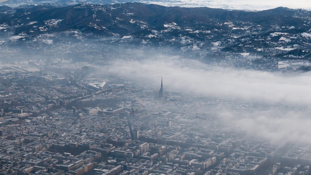 Turin aerial view. Torino cityscape from above, Italy. Winter, fog and clouds on the skylline. Smog and air pollution. Immagine